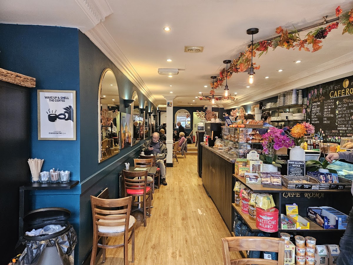 Inside Cafe Roma — cosy interior with warm lighting